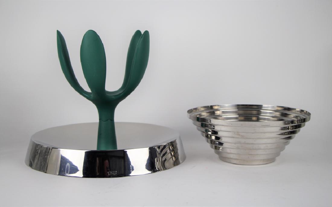 TWO PIECES OF ALESSI: Including a tiered aluminum bowl, signed but difficult to decipher, and a mixed plastic and stainless steel centrepiece, D. 33cm (13 1/4 in.). Total approx. weight 2.2 kg.