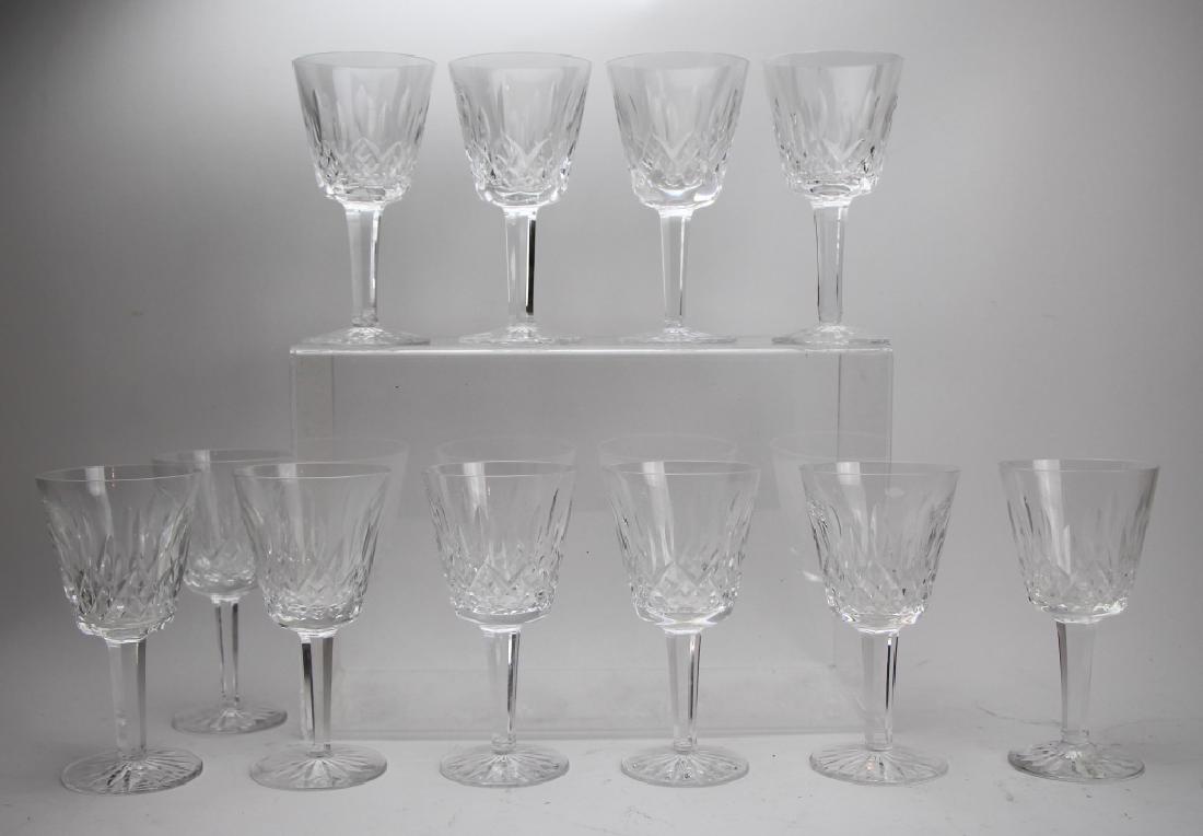 SET OF EIGHTEEN WATERFORD LISMORE WINE GLASSES: Acid etched signature. H. 15cm (6 in.). Total approx. weight 5.2kg. Only eleven photographed, but eighteen total.