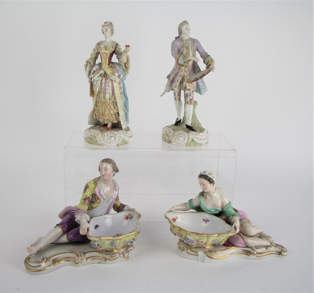 MEISSEN PORCELAIN FIGURES: Two reclining figures holding basin with flowers and insects painted at the interior. Each has loss and signs of old restorations. Two German figures, each with loss of lattice. H of tallest: 20 cm (8