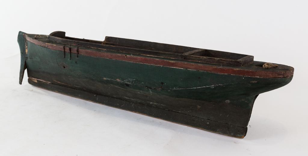 EARLY POND BOAT: Folk art wooden pond boat with original paint. As pictured Size: 6.5" h 28w 6d