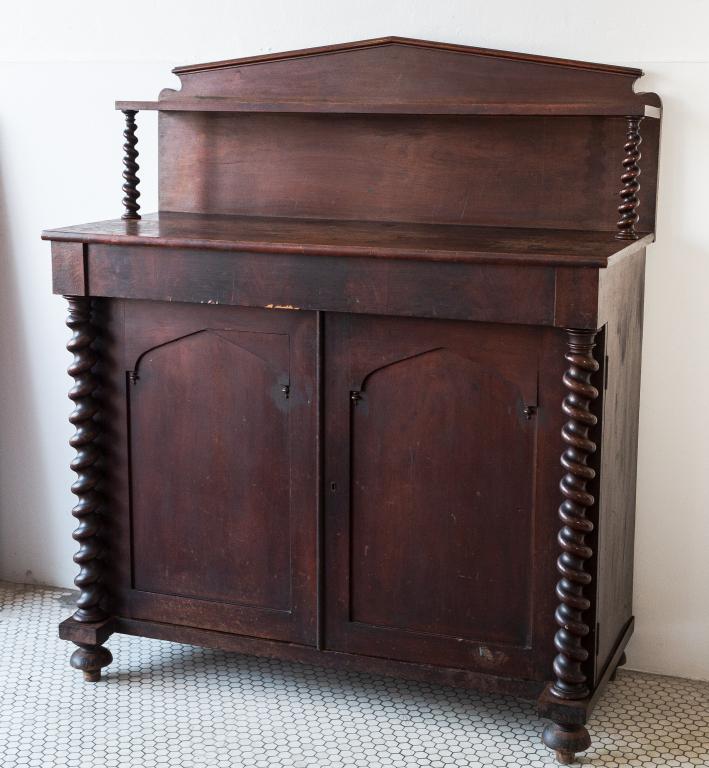 WALNUT SIDEBOARD: Eastern Ontario cupboard in original varnish. Unusual tapered and twisted pillars are part of the doors. with original back and shelf. Size: 55"h 47w 21d