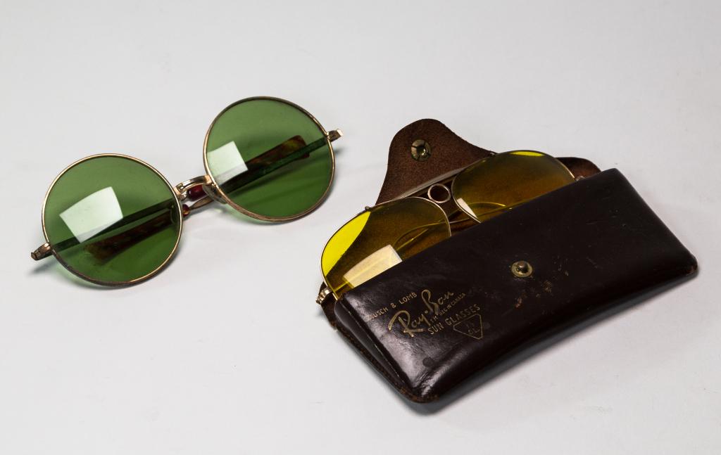 VINTAGE SUNGLASSES: 2 pairs, One Ray Ban in original patinated case. Length 6:"