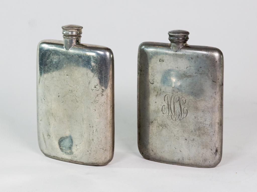 TWO JAMES DIXON & SONS PEWTER FLASKS: Early 20th century pewter flasks. Makers mark on bottom. Made in England. One monogrammed. Some wear. Ht. 6"