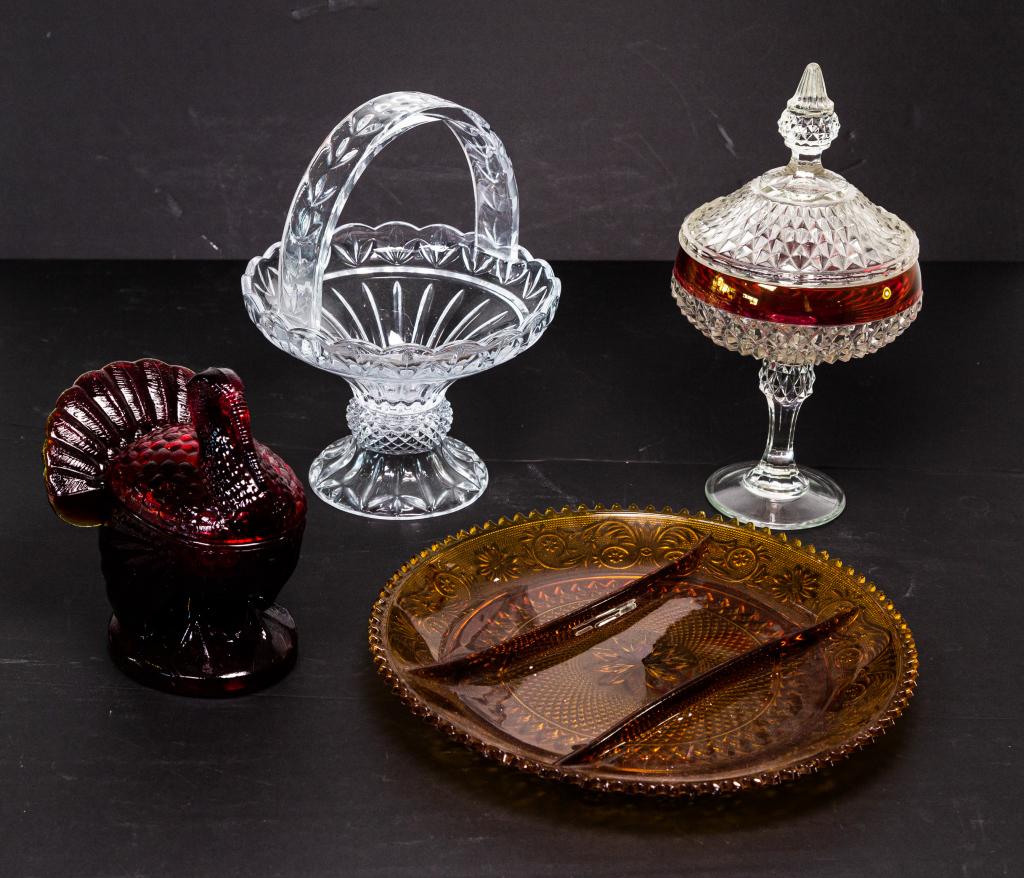 FOUR PIECES OF GLASS WARE: Including amberina glass turkey on nest, glass basket, amber glass divided dish and ruby flash covered jar. Ht. of tallest 12"