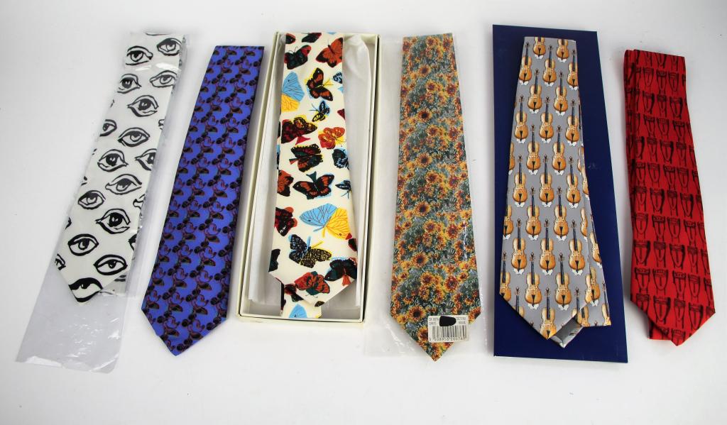 SIX SILK TIES: Including Andy Warhol micky mouse tie in Artes box, Raoul Dufy tie in box, Magritte violin tie in Artes box, Claude Monet floral tie, Magritte tie, and one other. All in like new condition. From the c