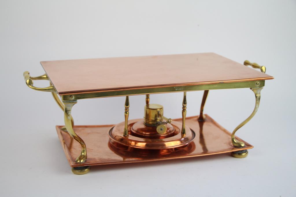 ANTIQUE COPPER AND BRRASS WARMING STAND: With removable try top, oil burner and stand. British made with registry marks for 1903. Length 43 cm. ( 17 in.) Approx weight 3 kg,