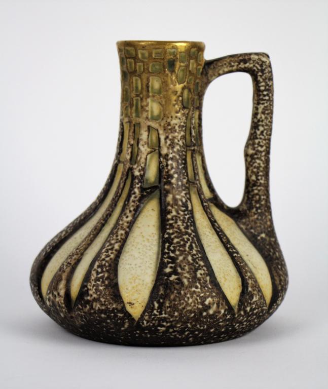 ERNST WAHLISS AMPHORA GILT JUG: With tree decoration and tree form handle. C.1900 with red Turn Ernst Wahliss mark, Made in Austria and impressed number 9485. Possibly a Paul Dachsel design ( reference: see Bonhams auction Nov. 12th