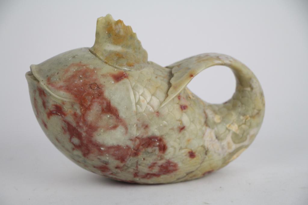 CHINESE SOAPSTONE FIGURAL FISH TEAPOT: Small single cup teapot with carved scale surface, tail for handle. With lid. Length: 15 cm. (6 in.) Approx. weight: 550 g.
