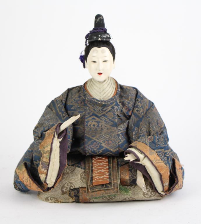 JAPANESE HINAMATSURI EMPRESS DOLL: With elaborate tapestry clothing. Probably straw filled, with gofun over wood head. Probably purchased at Holt Renfrew. From the collections of Paul Duval. Ht. 28 cm. (11 in.) Approx. weight: 350 g.