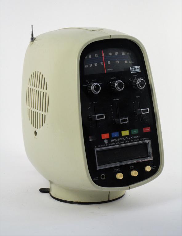 VINTAGE PORTABLE RADIO/EIGHT TRACK PLAYER: Adaptable for a/c, car or battery. With suction cup base. AM and FM radio working, didn't have an eight track cassette to test the player. Condition note: Tip missing off antenna (see photos) Ht. 30 c