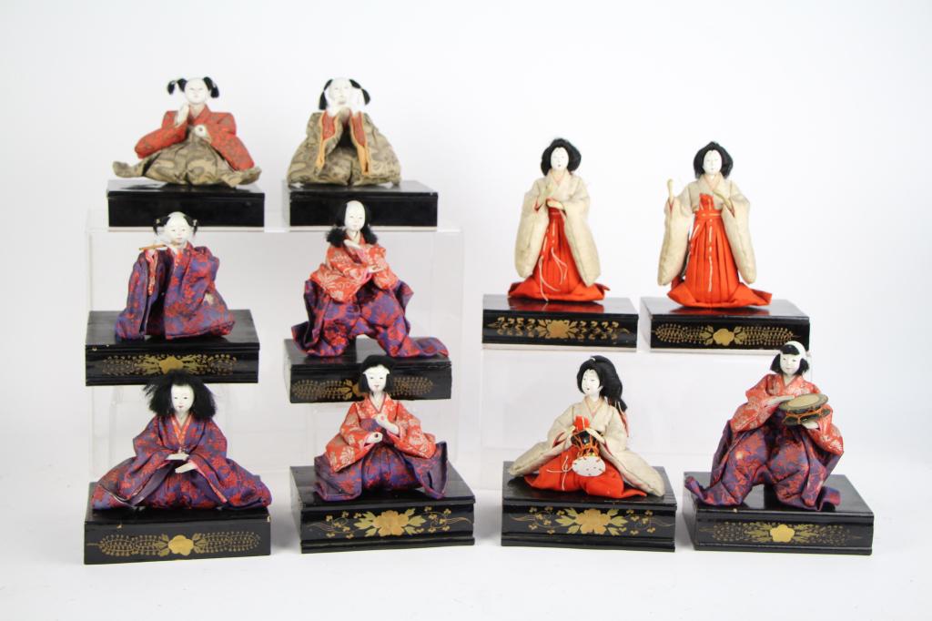 10 PIECE HINOMATSURI DOLL SET: All on laquer stands, some with original decoration. Straw filled, early 20th century. Some with instruments, most are missing. Purchased from Holt Renfrew in 1984, with original bill of sale. From th
