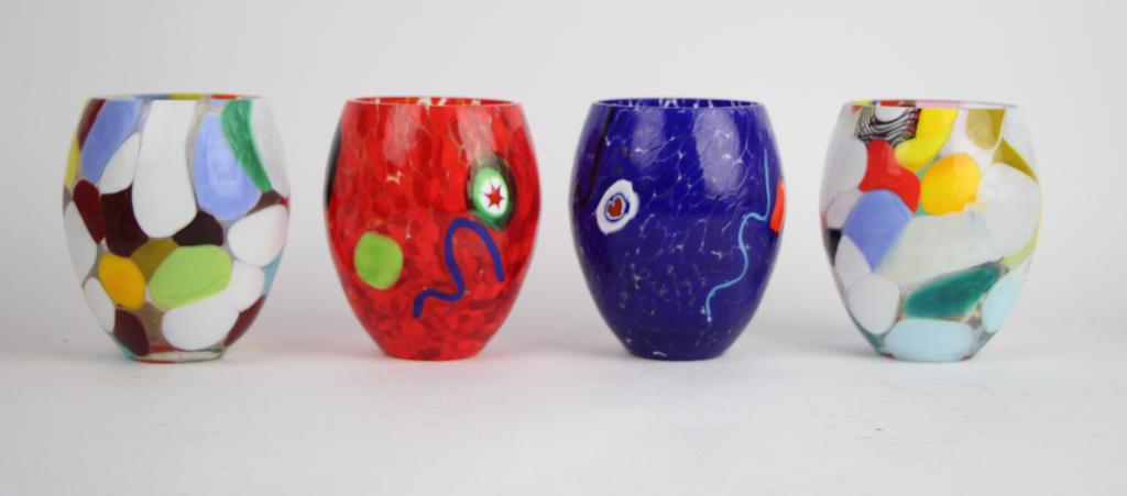 FOUR MURANO GLASS TUMBLERS: All signed on base with artist name and murano. Two patchwork style glasses and two with abstract designs. Ht. 11 cm. (4 1/4 in.) Total approx. weight: 1.2 kg.