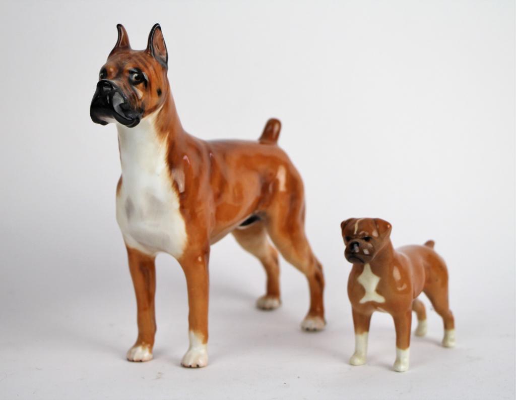ROYAL DOULTON AND BESWICK DOGS: Larger doulton boxer, HN number 2643, also stamped CH. Warlord of Mazelaine. Ht. of tallest: 16.5 cm. (6 1/2 in.) Total approx. weight: 330 g.