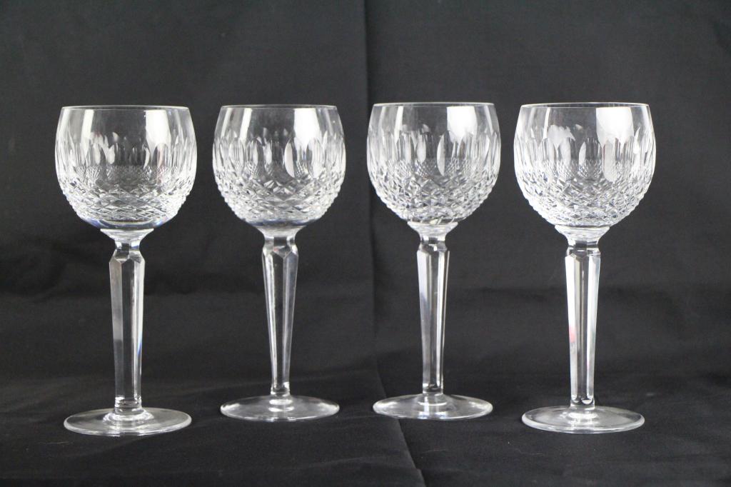 SET OF FOUR WATERFORD "LISMORE" WINE GLASSES: Withg acid etched signature. Ht. 19 cm. ( 7 1/2 in,.) Total approx. weight 1.5 kg.