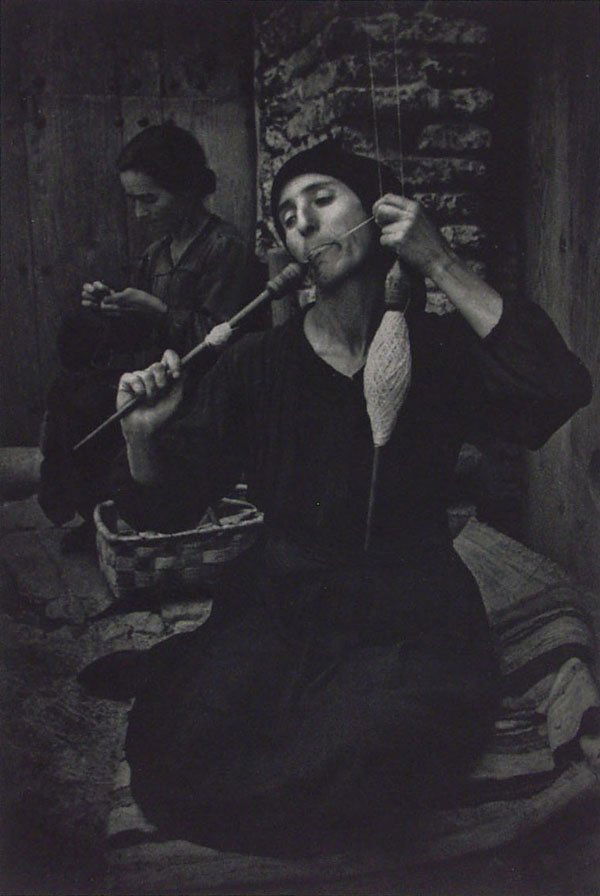 W. EUGENE SMITH (American) Photogravure: W. Eugene Smith (American, 1918 - 1978) The Spinner. Photogravure. 1951. Printed 1951. Print #335 of edition of 1000. 12 15/16 x 8 3/4 in. (329 x 222 mm). Fine condition. In original paper folder.