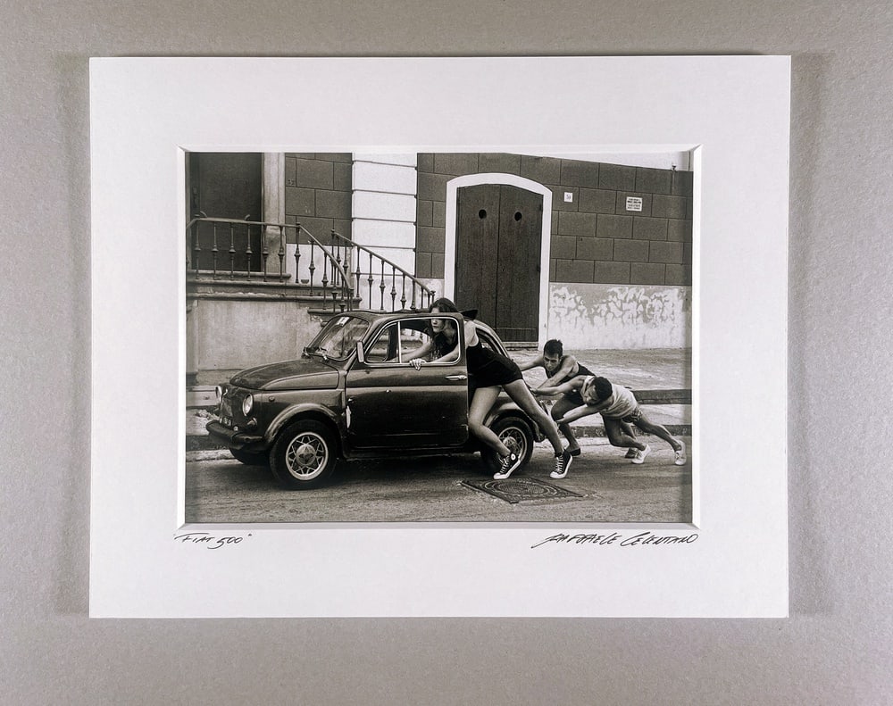 Raffaele Celentano, Fiat 500, Fine Art Photograph: An iconic black and white photograph by Italian photographer Raffaele Celentano, capturing a timeless scene with the legendary Fiat 500. Shot in 1994 on ISO 400 film, the work embodies Italian culture