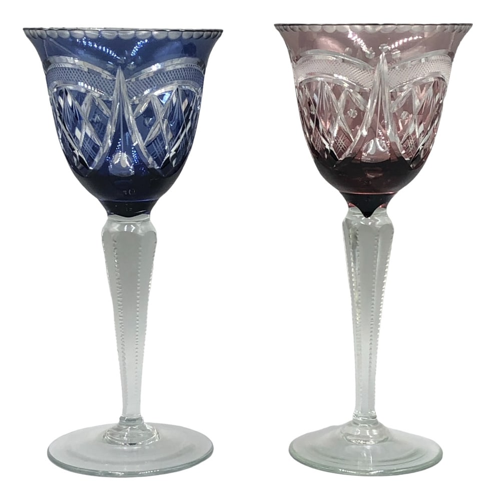 Saint Louis Wine Glasses, 1890s, Set of 2: This exquisite set of two wine glasses from Saint-Louis, one of France's oldest and most renowned crystal manufacturers, impresses with its masterful craftsmanship and timeless elegance. The lenses