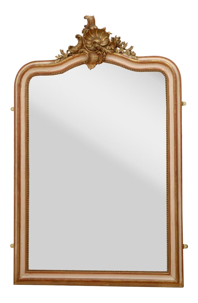 19th Century French Wall Mirror: Beautiful French, cream and gold leaf wall mirror, having original bevelled edge glass with some foxing in beaded and shaped frame with shell and floral centre crest to the top. This antique mirror re