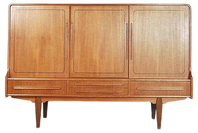 Vintage Danish Teak High Sideboard, 1950s: This vintage modern highborn was manufactured in Denmark during the 1950s. It has been finished in teak in warm honey tone. The cabinet has three sliding doors with shelves and mirror inside. It has a