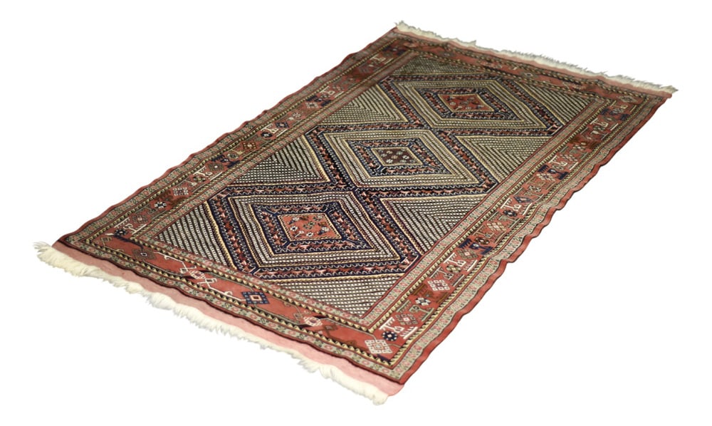 Vintage Oriental Hand-Woven Shiraz Rug, 1960s: This hand-woven Shiraz rug was made in Iran during the 1960s. It is dyed in shades of red, navy blue, beige, and black with subtle accents of white and made of natural wool on a cotton warp. This rug