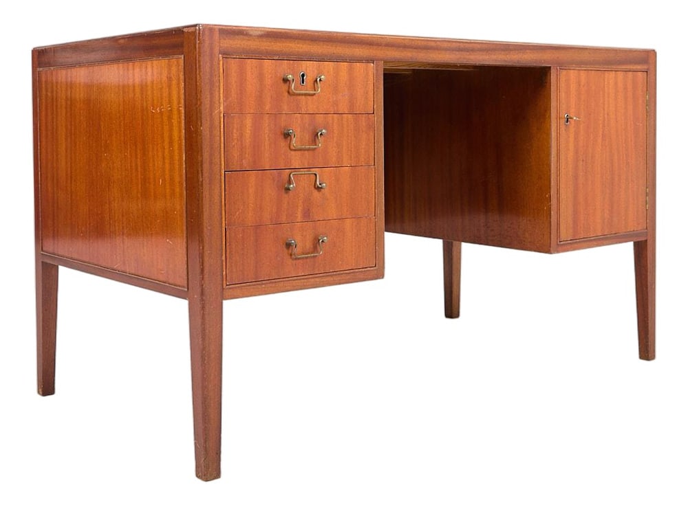 Mid-Century Scandinavian Modern Desk, 1950s: This minimalistic design mahogany veneer desk was produced in 1950’s, Denmark. It features various drawers, brass handgrips.Condition Good, age-related wear and marks, scratches. Production