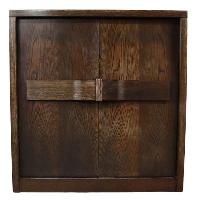 Brutalist Bar Cabinet, Belgium, 1970s: Brutalist bar cabinet with two doors, several shelves, 3 drawers and an illuminated bar area.The doors have beautiful curved plywood handles.Dxhxl: 47x137x131 cm Country of Manufacture: Belgium