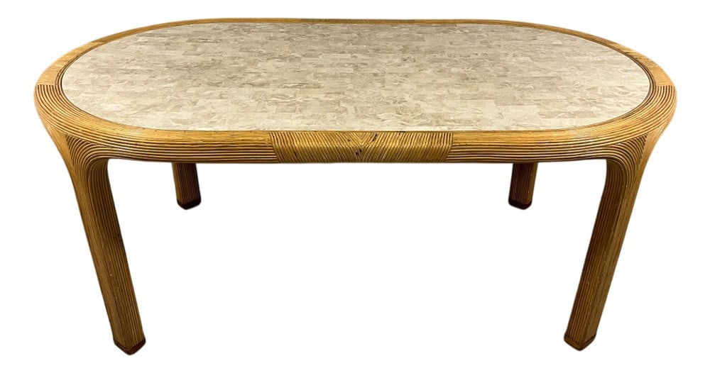 Dining Table from Vivai Del Sud, Italy, 1960s: Exceptional dining table by Vivai del Sud, Italy.Oval wooden frame covered with rattan in a refined pattern.The table top is inlaid with small thin pieces travertine which givesa chic elegant effect.