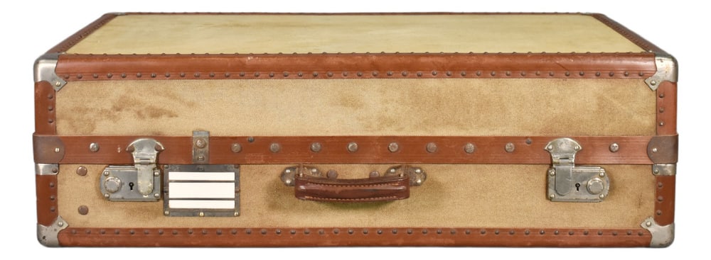 French Antique Steamer Trunk Suitcase, 1920s: French Antique Steamer Trunk Suitcase A sturdy Steamer Trunk / Travelling Suitcase that features reinforced corner brackets and leather-bound edges. It is covered in a light cream canvas on all sides.