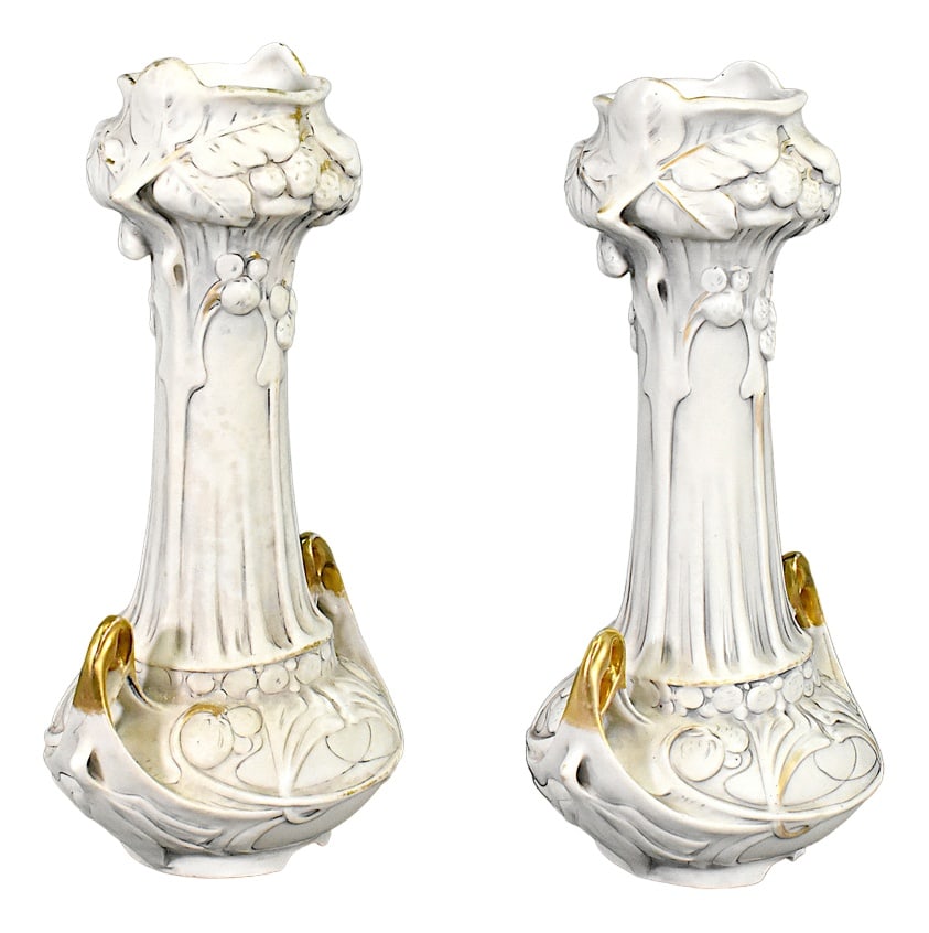 Set of Art Nouveau Vases Royal Dux Bohemia, 1920s: Pair of Art Nouveau Vases Royal Dux Bohemia A lovely pair of Art Nouveau vases in biscuit porcelain with relief and partial gilding. The vases feature delicate woodland berries and floral decoration i