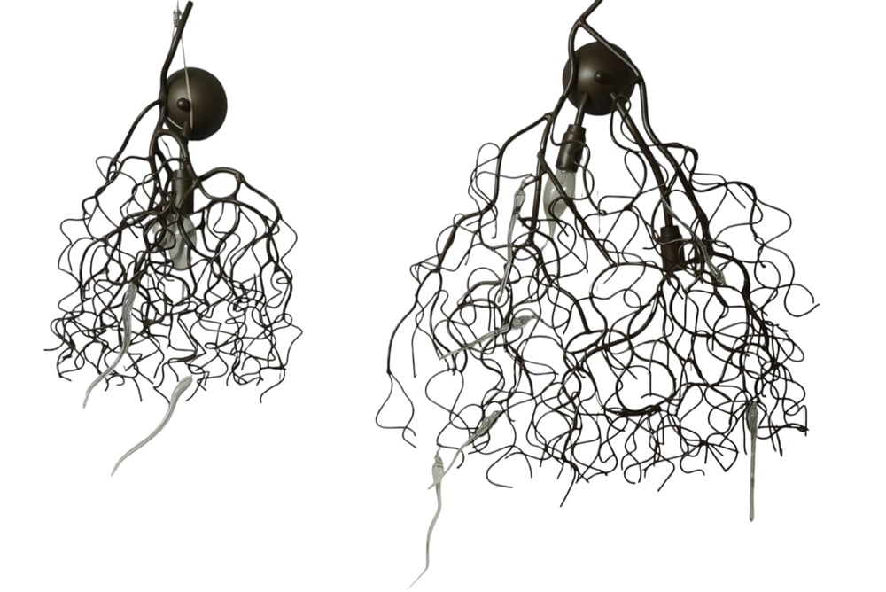 Hollywood Lamps from Brand & Van Egmond, Set of 2: Two artistic designer wall lights from Brand & Van Egmond, handmade from intertwined black metal wire and inspired by the aesthetics of modern sculptures. The lights create fascinating patterns