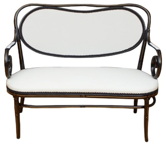 Sofa with Cushions by Micheal Thonet, 1880s: Rare ebonised sofa by Thonet, having shaped top rail with kidney shaped back, generous seat and open scroll arms, standing on outsewpt legs, all with gilded decoration throughout. This antique sofa
