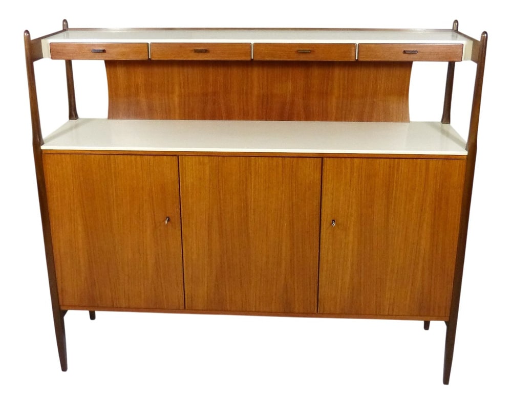 German Highboard from Deutsche Werkstatten, 1960s: Highboard by Deutsche Werkstatten, Germany. (marked)Teak wood with white laminated tops.Under the upper top 4 small drawers, beneath 3 doors with 3 shelves and 1 drawer. Country of Manufacture: