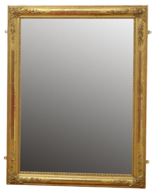19th Century Gilded Wall Mirror: Very attractive giltwood wall mirror of versatile form, it can be hung horizontal or vertical way, having replacement glass in moulded and gilded frame with floral decorated corners. This antique mirr
