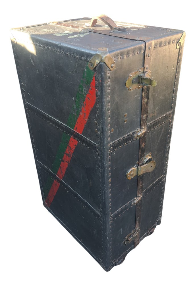 Vintage Vertical Travel Trunk, 1920s: Antique vertical travel trunk, a wardrobe trunk from the early to mid-20th century (circa 1920s–1940s).Made of wood covered with black canvas and reinforced with metal corner protectors and