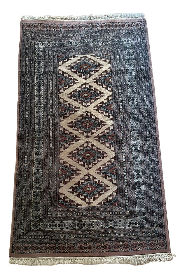 Wool Rug, Pakistan, 1970s: hand-knotted wool carpet, Pakistan origin, 70sWear photographed Country of Manufacture: Pakistan Design Period: 1970 to 1979 Restoration and Damage Details: Patina consistent with age and use