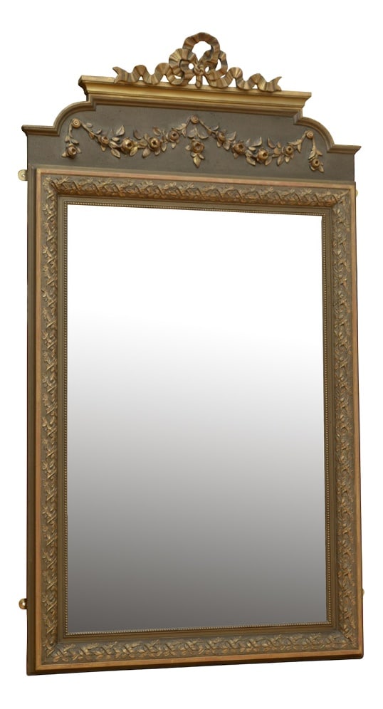 Antique Wall Mirror, 1900s: Attractive French wall mirror, having original bevelled edge glass in moulded and flower carved gilded frame with floral swags on a olive green board and gilded bow to the top. This antique mirror