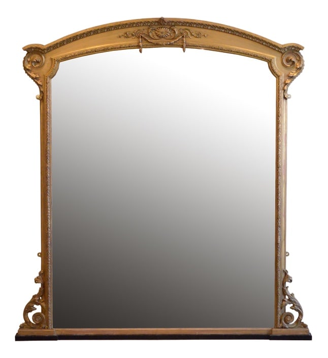 Large Victorian Giltwood Overmantle Mirror, 1850s: A Large Victorian Overmantel giltwood mirror or arched form, having original mercury glass with some foxing and desirable sparkle in gilded frame with moulded can finely carved cornice above floral fr
