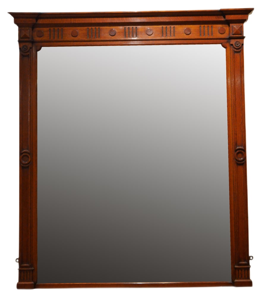 Large Victorian Oak Wall Mirror: Outstanding English wall mirror of large proportions, having original glass with some age related foxing, the frame having moulded cornice above reeded frieze applied with paterae and moulded pilaster