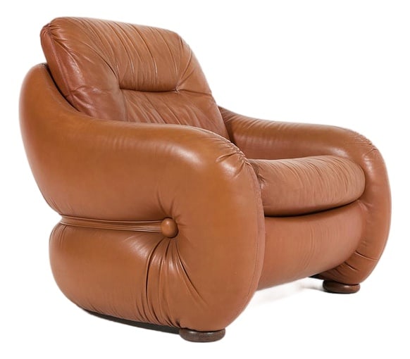 Italian Sculptural Leather Lounge Chair, 1960s: Italian mid-century modern sculptural armchair in brown cognac leather, produced in 1960's. ConditionFair, age related usage marks and wear Seat dimensionswidth: 96 cmdepth: 92 cmheight: 78 cmse
