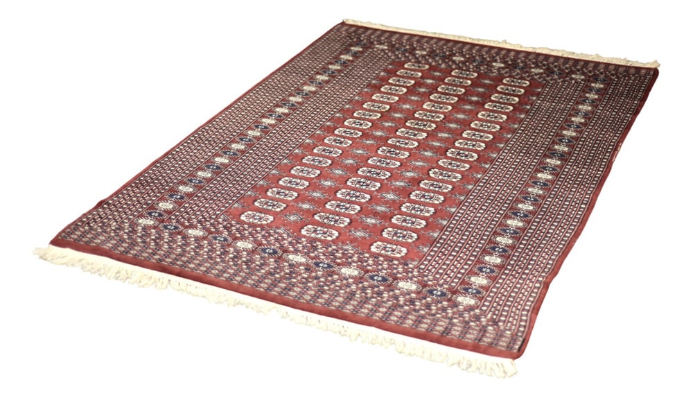 Vintage Red Hand-Woven Oriental Bokhara Rug, 1960s: This hand-woven oriental Bokhara rug was made in Pakistan during the 1960s. Woven in the traditional way – flat technique, with the addition of cashmere and natural dyed in shades of rustic red