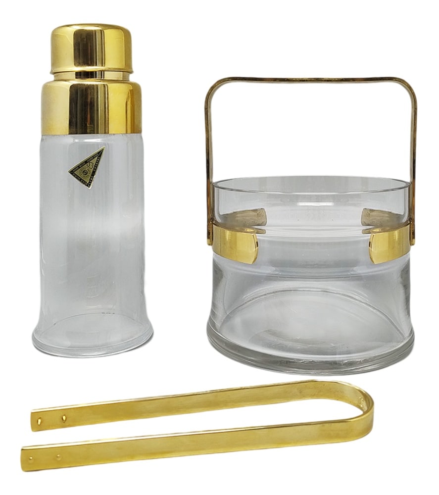 Cocktail Set of 3 in Gold Plate 24k from Dorval: 1970s Gorgeous cocktail shaker with ice bucket in gold plate 24K and crystal and with the original ice tongs. Hand Made. Made in Italy. Signed at the bottomThe items are in excellent