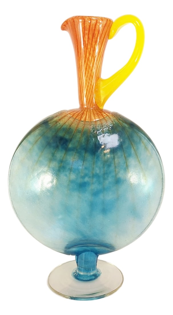 Bon Bon Jug by Kjell Engman for Kosta Boda, 1989: A vibrant hand-blown carafe from Kjell Engman’s playful Bon Bon series for Kosta Boda. Made in 1989 and signed to the base. It features a spherical aqua-blue body, an amber-coloured ribbed