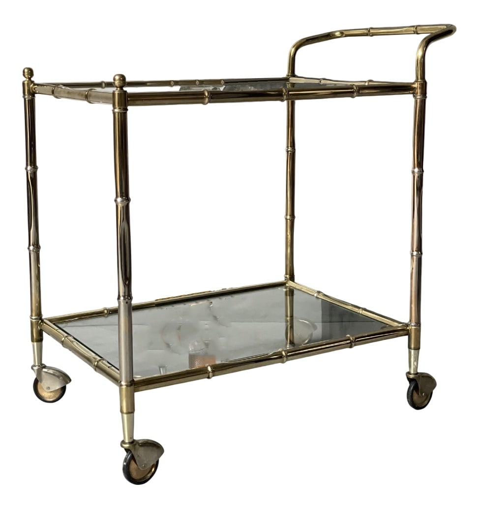 Vintage Golden Bar Cart: This elegant golden bar cart from 1881, exudes retro charm and timeless sophistication, perfect for elevating your entertaining space with a touch of luxury. Country of Manufacture: France Design