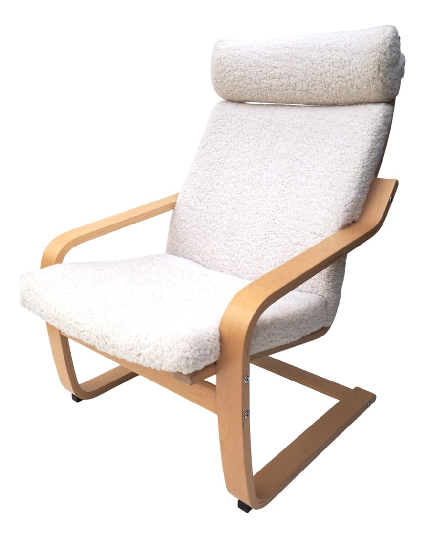 Poäng Armchair by Noboru Nakamura for Ikea, 2011: An iconic armchair from IKEA's most beloved collection, designed by the Japanese designer Noboru Nakamura. This exclusive version with genuine sheepskin combines Scandinavian comfort with Japanese