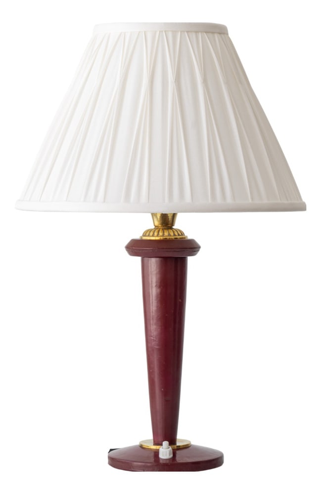 Burgundy Leather Table Lamp from Maison Lancel, 1940s: Maison Lancel French table lamp in burgundy leather with brass details, circa 1940s–1950s, newly fitted with a white silk lampshade. This distinctive piece exemplifies the refined leather crafts