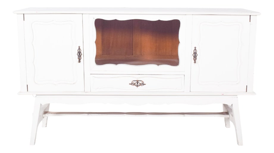 Vintage European White Painted Sideboard, 1920s: Sideboard painted white. The sideboard is marked by sinuous lines in the door cut-outs and the central niche, as well as the sloping feet that support a base with a connecting bar. The machined metal