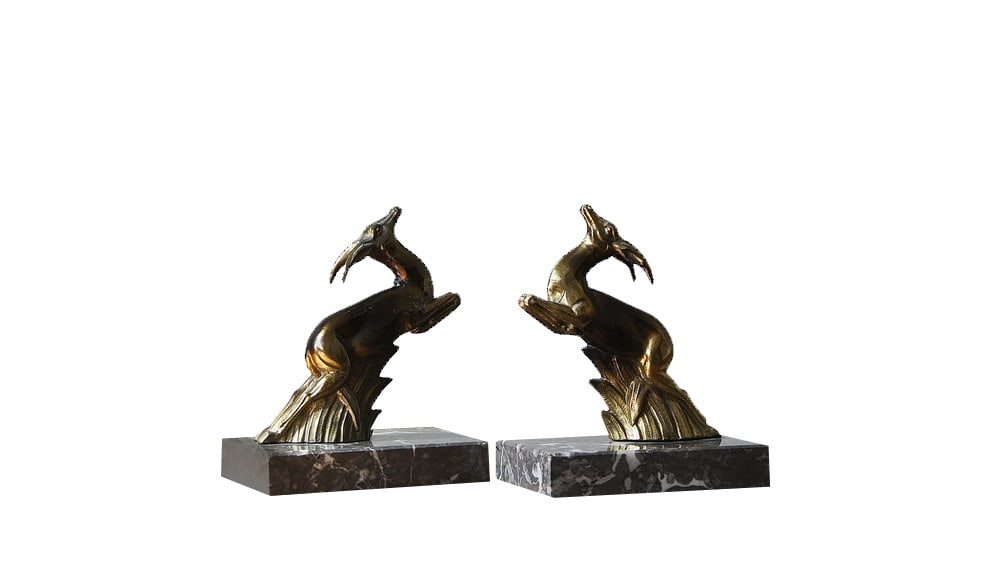 Antelope Bookends on Marble Bases, 1930s, Set of 2: A beautiful pair of French Art Deco period bookends.The bookends have Springbok Antelopes, in jumping pose, set on Italian marble bases. Each antelope has been well modeled with good detail. The