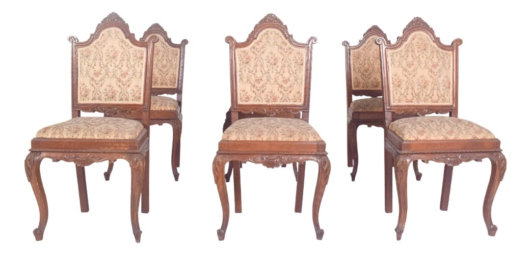 Antique Portuguese Dining Chairs, 1890s, Set of 6: Six Louis XV style dining chairs. In carved wood, of late 19th century French influence, high backrests framed by a curved profile and top cut-out with side volutes, carved central medallion,
