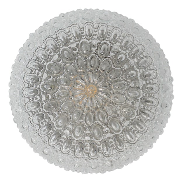 Sirius Sconce by Tynell for Glashütte Limburg, 1970s: The Sirius ceiling lamp, designed by Helena Tynell for Glashütte Limburg, is an icon of 1960s and 1970s design. The shade is made of thick glass, the surface of which has been formed into a disti