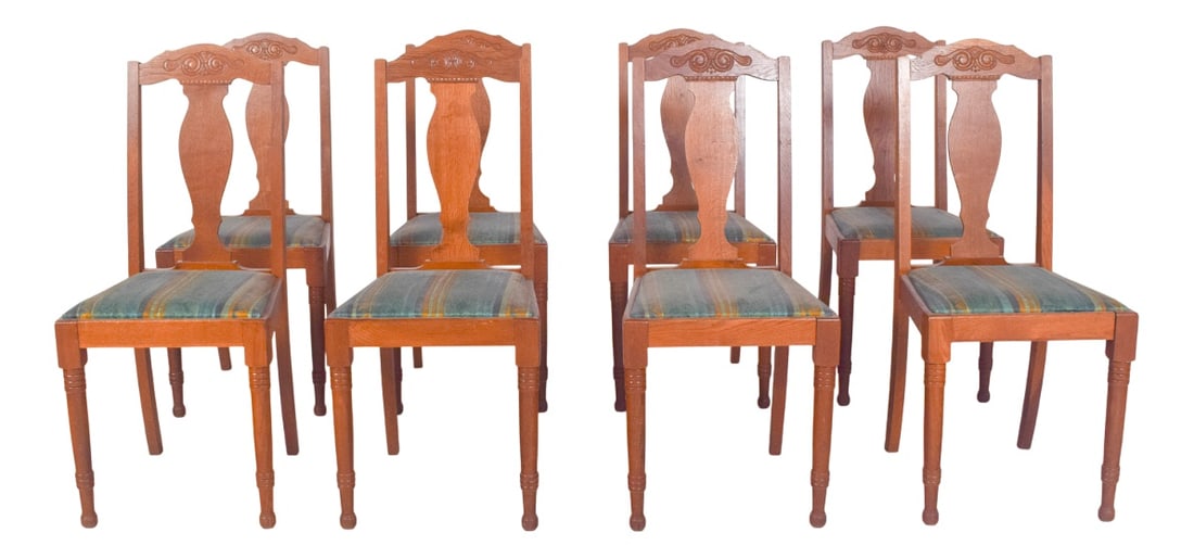 Danish Rustic Oak Chairs, 1950s, Set of 8: Set of eight oak chairs. Seats upholstered in striped fabric in shades of green, blue and yellow, with a firm and well-preserved structure. The backrest features a cut-out design with a central motif
